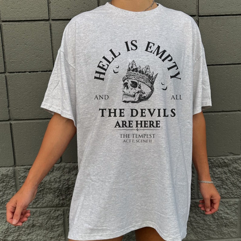 May include: Gray oversized t-shirt with a skull wearing a crown and the text "Hell is empty and all the devils are here. The Tempest Act 1, Scene II"