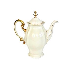 May include: A cream-colored porcelain teapot featuring a glossy finish, a curved handle, a matching lid with a finial, and a spout. The teapot is accented with gold trim along the edges of the handle, the lid, the spout, and the base.