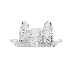 May include: A clear glass salt and pepper shaker set with a matching tray. The shakers and tray have a cut glass design.