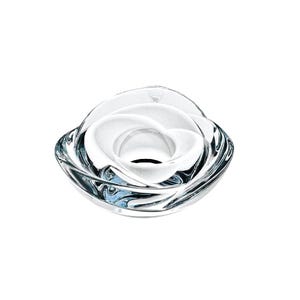 May include: A clear glass decorative bowl with a swirling, organic design. The bowl has a central, rounded opening and a layered, petal-like structure. The glass has a reflective quality, with subtle blue and white highlights. The bowl is likely for decorative purposes.