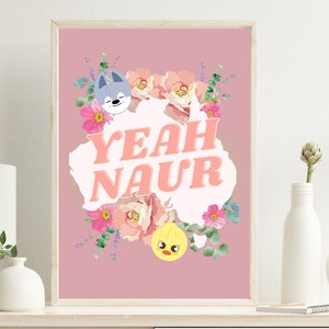 May include: Pink floral print with a white outline of Australia, with the text "YEAH NAUR" in a retro font. A grey wolf and a yellow chick are peeking out from behind the flowers.