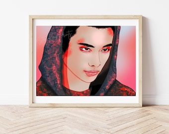 May include: A framed art print featuring a digital illustration of a person with red eye makeup and a dark hooded garment. The artwork has a pink and red gradient background. The print is in a light wood frame.