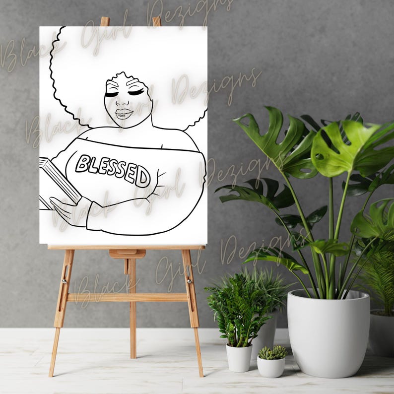 May include: Black and white line art illustration of a woman with an afro hairstyle wearing a shirt that says "Blessed" and holding a book. The illustration is on a white canvas on an easel.