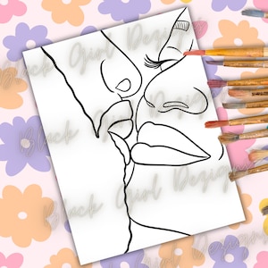 May include: A black and white line art print of two faces in a kissing pose. The artwork is on a white paper with the words "Black Girl Designs" in a cursive font. Paintbrushes are visible on the right side of the image.