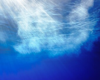 Abstract underwater photo of rays of light