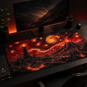 May include: A rectangular desk mat featuring a dark, volcanic landscape with a towering black spire and flowing lava. The design incorporates swirling, fiery orange and red patterns across a black background, creating a dramatic, high-contrast scene.