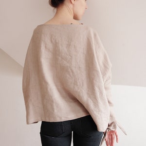 Handmade oversized linen kimono top for women – beige, minimalist, boho-chic style with long sleeves and tie details. Perfect for casual, sustainable, and breathable fashion