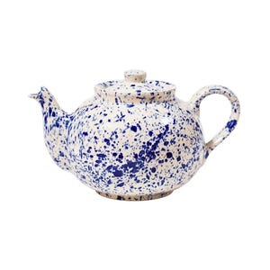 May include: A white ceramic mug with a black handle and the text "But First, Coffee" in a bold, black font. The mug is set against a neutral background, highlighting its simple design.