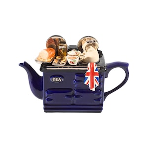 May include: A navy blue stove-shaped teapot, featuring a Union Jack flag and the word "TEA". It's adorned with miniature food items and a small teacup. The teapot has a handle and a spout, perfect for serving tea.