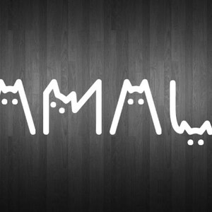 May include: The word "KAMALA" is spelled out in white against a dark wood background. Each letter is formed by two white cat ears with a white face in the middle.