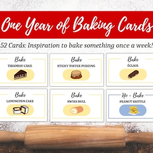 May include: A set of 52 baking cards with illustrations of different desserts, including tiramisu, sticky toffee pudding, éclair, lamington cake, Swiss roll, and peanut brittle. The cards are yellow with black text and are arranged in three rows on a wooden surface.