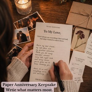May include: A paper anniversary keepsake with handwritten text, photos, and a receipt. The text reads "To My Love" and includes a personal message. The image also features a lit candle and a wrapped gift.