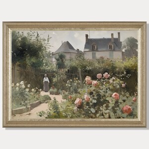 May include: A framed painting depicts a garden scene with a woman walking a path. Pink and white roses bloom in the foreground, with a house and trees in the background. The frame is gold-colored.