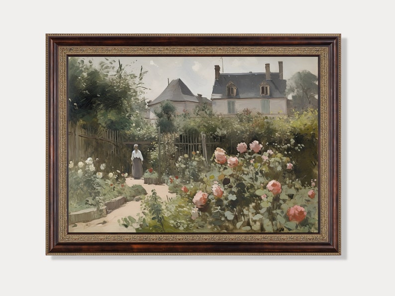 May include: A framed painting depicts a garden scene with a woman walking on a path. The garden features blooming pink and white roses, lush greenery, and a house in the background. The frame is a dark brown color.