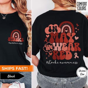 May include: Black t-shirt with a red, white, and pink rainbow design and the text "In May We Wear Red #stroke awareness".