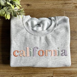 embroidered custom sweatshirt, personalized city shirt, multicolor embroidered sweatshirt, USA travel souvenir, colorful state sweatshirt