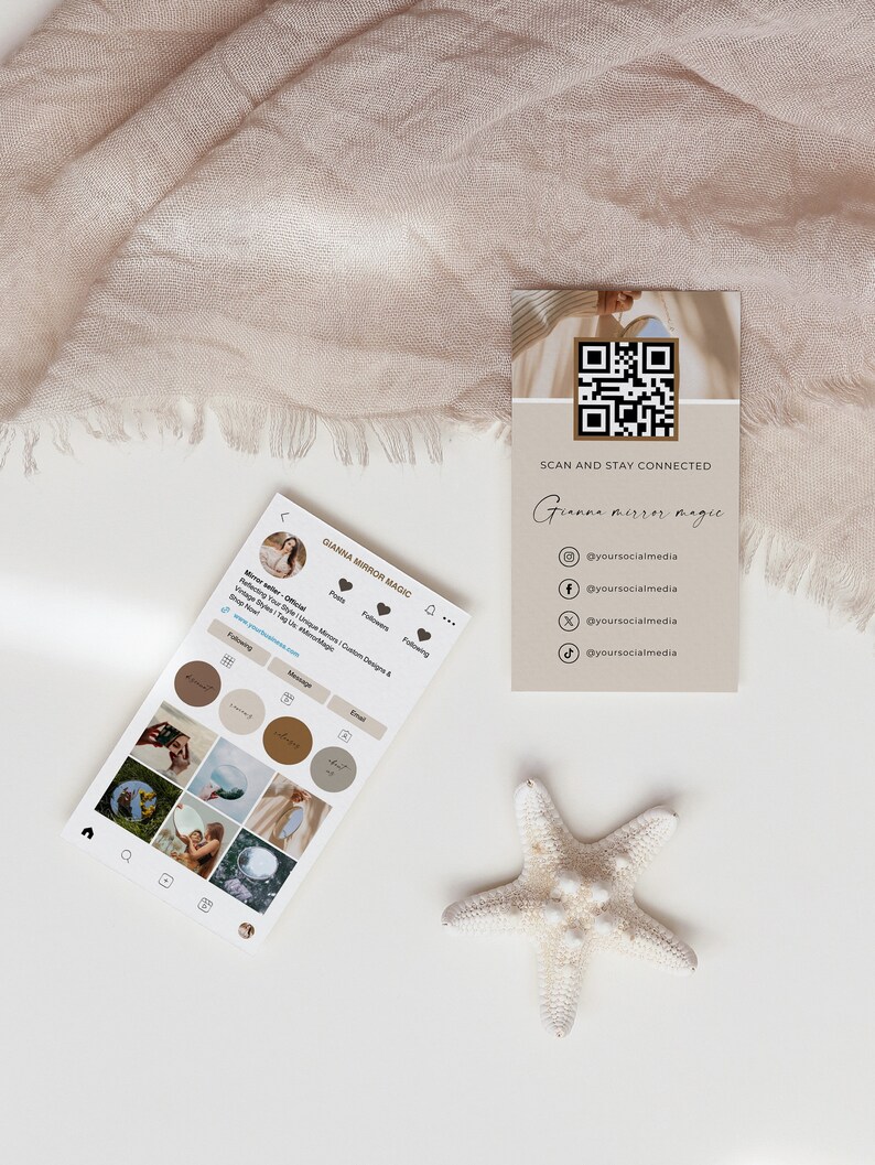 May include: A white card with a QR code and the text "Scan and Stay Connected Gianna Mirror Magic" with social media handles listed below. The card is on a white surface with a beige fabric and a white starfish.