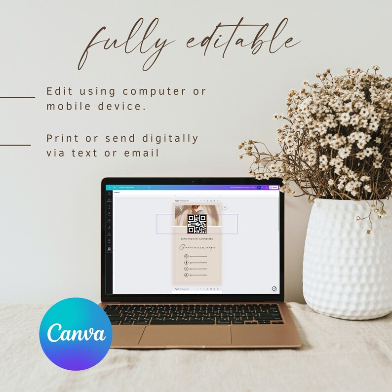 May include: A laptop computer displaying a Canva design template with a QR code and the text "Scan and Stay Connected". The design also includes a list of social media icons and links. The laptop is on a table with a white vase of dried flowers.