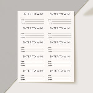 May include: A sheet of cream-colored paper with multiple "ENTER TO WIN!" forms. Each form includes fields for name, email, and phone number. The text is in a simple, clean font, suitable for sweepstakes or contests.