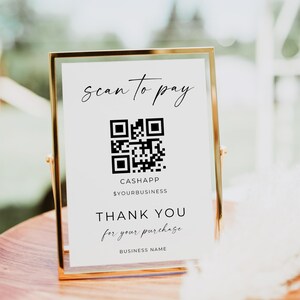 Puede incluir: Un cartel blanco con marco dorado, que muestra un código QR en blanco y negro. El cartel dice "scan to pay", "CASHAPP", "$YOURBUSINESS", "THANK YOU for your purchase", y "BUSINESS NAME".