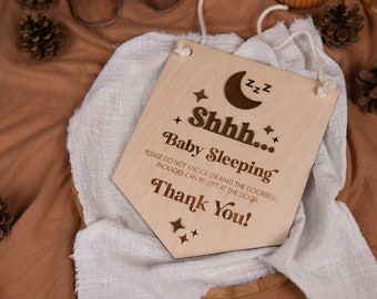 May include: A wooden sign with a crescent moon and stars, reading "Shhh... Baby Sleeping. Please do not knock or ring the doorbell. Packages can be left at the door. Thank You!"
