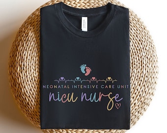 May include: Black t-shirt with a white heartbeat graphic and the text "Neonatal Intensive Care Unit nicu nurse" in colourful lettering. The graphic also includes two pink and blue footprints.