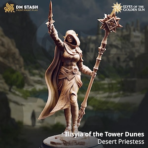 May include: A detailed figurine of Ilisyia of the Tower Dunes, a Desert Priestess, holding a sword and staff. The figure is in a dynamic pose, wearing a hooded cloak and armor. The color is a light brown. The text "DM STASH PRINT.PAINT.PLAY" and "ELVES OF THE GOLDEN SUN" are visible.