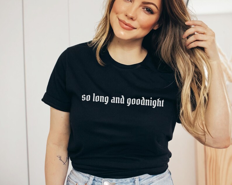 May include: A black t-shirt with the text "so long and goodnight" in white lettering.