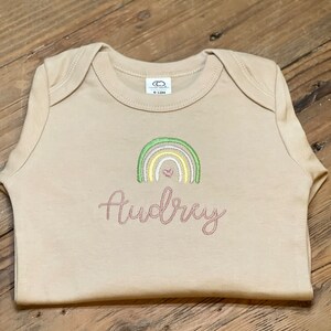 Personalized onesie with rainbow and heart