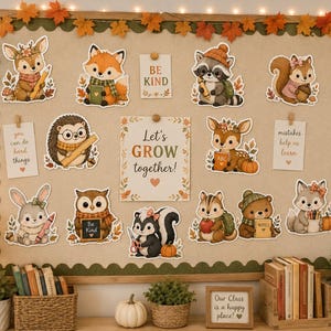 May include: A bulletin board decorated with autumn-themed cutouts of woodland animals including a deer, fox, raccoon, squirrel, hedgehog, owl, skunk, chipmunk, bear, and wolf, alongside cards with text like Let's GROW together and BE KIND.