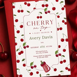 May include: A white baby shower invitation card featuring a red cherry pattern, a red baby bottle illustration, and text reading CHERRY on top A BABY SHOWER Avery Davis July SATURDAY 4TH AT 2 PM 123 anywhere st., any city, st 12345 Please RSVP to Gabrielle at 123-456-7890.