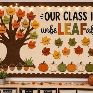 May include: A classroom bulletin board display featuring a large brown tree with orange, yellow, and green paper leaves, each labeled with a name. The text reads OUR CLASS IS unbeLEAFable! with additional paper leaves and pumpkins below.