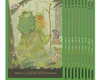 May include: A green, leafy creature with a long beard carries a stack of wrapped gifts through a forest. A raccoon sits on a tree stump and a squirrel sits on a rock. The text "Wishing you a LEGENDARY holiday season" is at the bottom of the card.