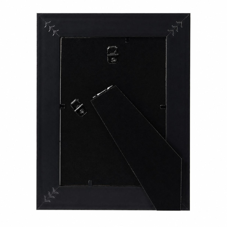 a black picture frame with a triangular shape and a small handle on the right side.