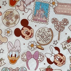 May include: A white fabric with a repeating pattern of Disney characters and icons. The characters include Mickey Mouse, Minnie Mouse, Donald Duck, Goofy, and a castle. The icons include a lollipop, a globe, a flower, and a star. The fabric is printed with the text "It's a Small World After All" and "I'd Rather Be At Disney".