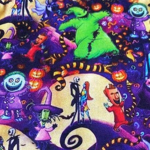 May include: A colorful fabric featuring characters from The Nightmare Before Christmas. The design includes Jack Skellington, Sally, Oogie Boogie, and other characters, with a background of swirling patterns, pumpkins, and a crescent moon.