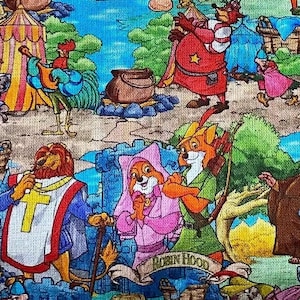 May include: A colorful fabric featuring characters from the animated film "Robin Hood." The design includes images of anthropomorphic animals in medieval attire, castles, and forest scenes. The color palette is vibrant, with blues, greens, reds, and yellows.
