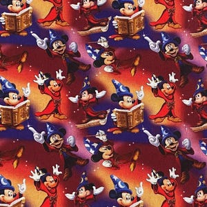 May include: A repeating pattern of Mickey Mouse dressed as a sorcerer, holding a book and a wand, on a blue background with stars. The background is a gradient of red, orange, and yellow.