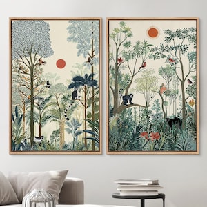 May include: Two framed art prints depict a jungle scene with trees, lemurs, and birds. The artwork features a warm color palette with shades of green, blue, and orange. The prints are displayed above a light-colored sofa in a living room setting.