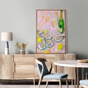 May include: An abstract painting of a dining scene with oysters, champagne, and lemons. The artwork features a pink background, a green champagne bottle, and several champagne flutes. The oysters are arranged on a plate with lemon slices.