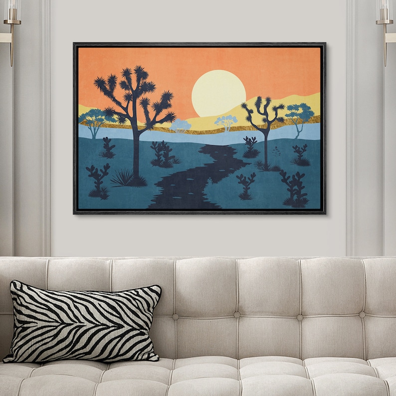K&ouml;nnte beinhalten: Ein digitaler Kunstdruck eines W&uuml;stenlandschafts mit untergehender Sonne, einem gewundenen Fluss und silhouettenartigen Joshua-B&auml;umen. Die Farben sind ein warmes Orange, Gelb und Blau.