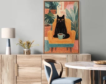 May include: A framed art print depicts a black cat seated in an orange armchair, holding a teal mug. The cat is in a room with plants and a window. The artwork has a pencil-drawn style with a wooden frame. The overall theme is home decor.