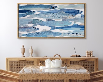 May include: A rectangular wall art piece featuring a watercolor illustration of multiple fish in various shades of blue, ranging from light sky blue to deep navy, arranged in a dense school pattern within a thin, light-colored wooden frame.