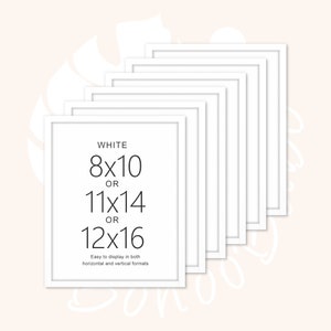 May include: A set of eight white picture frames, stacked in a staggered pattern. The frames are designed to fit 8x10, 11x14, or 12x16 inch photos. The text "WHITE" and the dimensions "8x10", "11x14", and "12x16" are printed on the front of the frame. The text "Easy to display in both horizontal and vertical formats" is also printed on the frame.