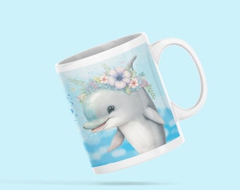 May include: White ceramic mug with a blue and white illustration of a dolphin wearing a flower crown. The dolphin is swimming in blue water with white clouds.