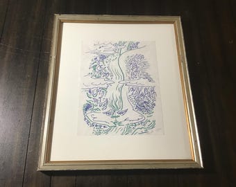 May include: A framed black and white line drawing of a landscape with a river flowing through it. The drawing is done in blue and green ink and is set against a white background.