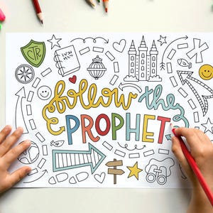 May include: A white colouring page featuring the text follow the PROPHET in colourful bubble letters, surrounded by black and white line art illustrations including a temple, arrows, stars, hearts, a compass, binoculars, and a shield with CTR.