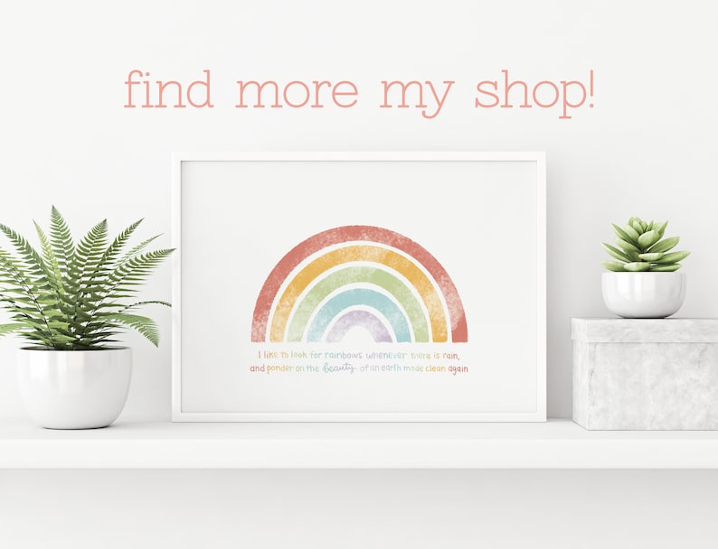 May include: A white framed wall art print featuring a textured, multi-colored rainbow graphic in shades of red, orange, yellow, green, blue, and purple. Below the rainbow, the text reads: I like to look for rainbows whenever there is rain, and ponder on the beauty of an earth made clean again.