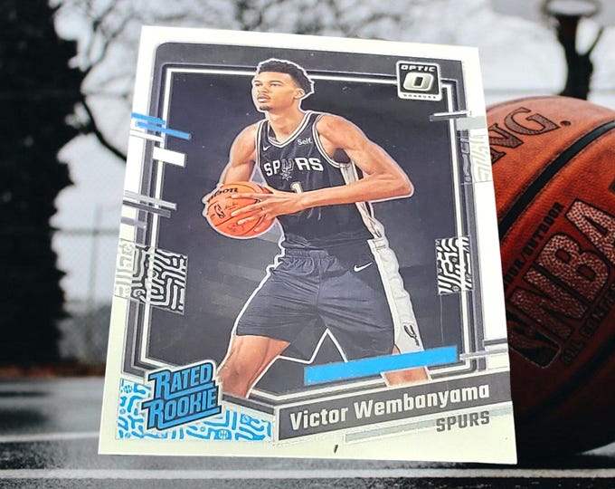 Featured listing image: Victor Wembanyama Holographic Panini Optic Rookie Card