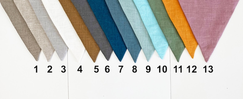 May include: Thirteen fabric swatches in various colors and textures, including beige, white, brown, gray, blue, teal, light blue, green, orange, and pink.